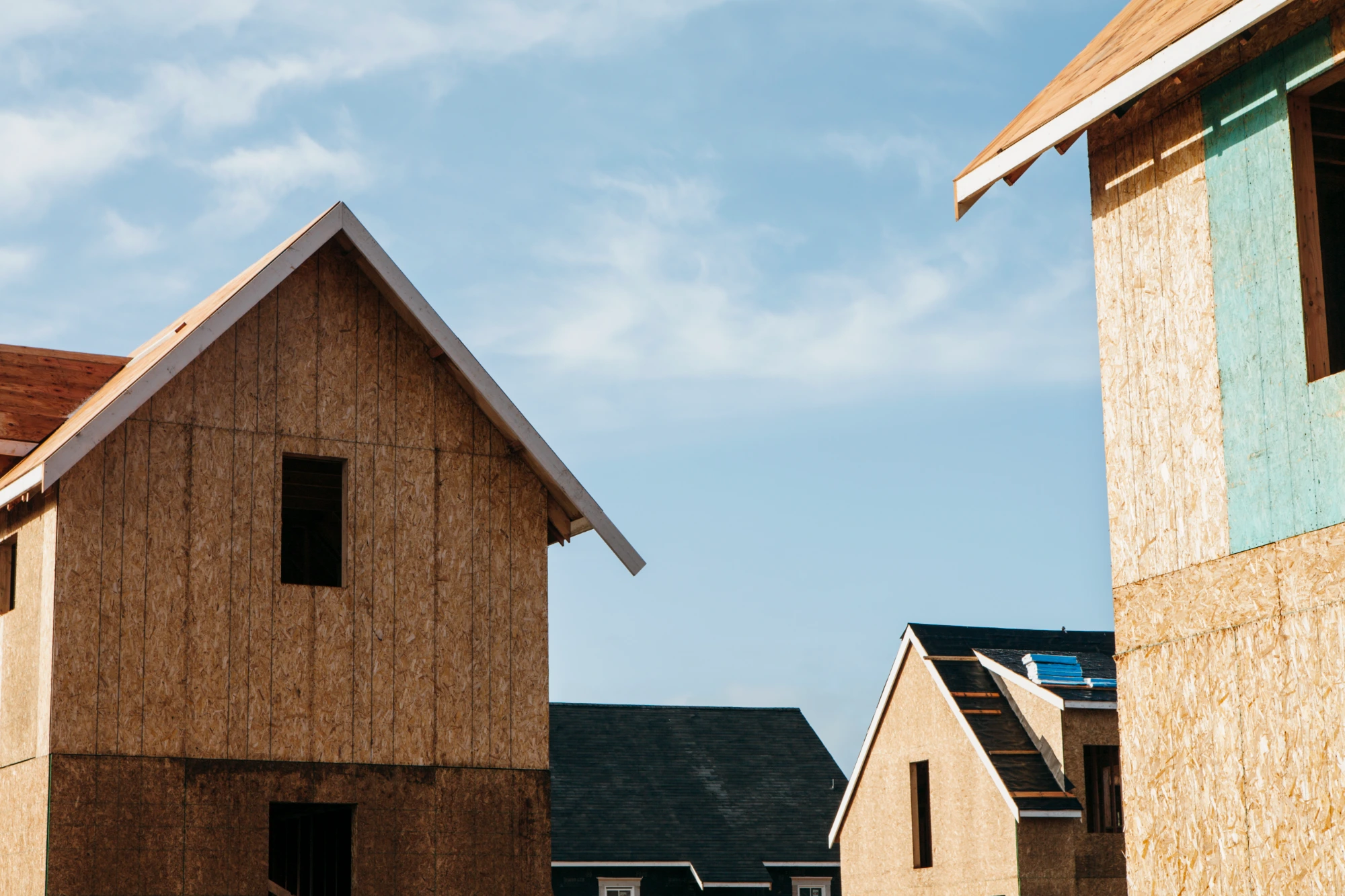 New home construction in progress with wood framing by Crystal Cabinets in Midland, TX.