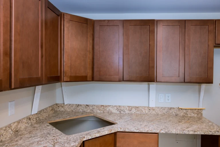 Kitchen cabinet and countertop refresh in with new granite countertops completed by Crystal Cabinets Inc in Midland, TX