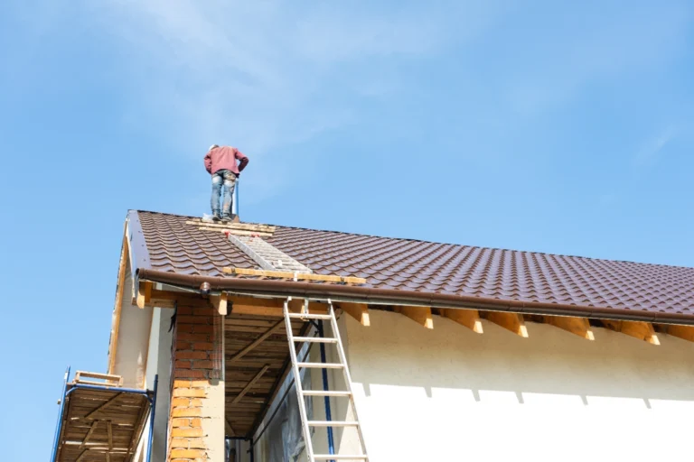 Roofing contractor repairing a residential roof in Midland, TX