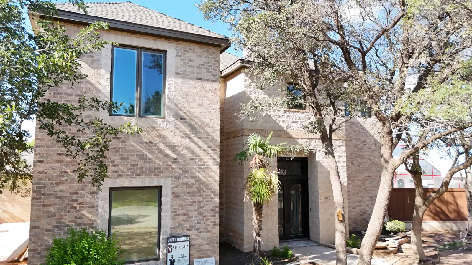 Two-story brick home being remodeled by Crystal Cabinets Inc. on Mira Vista Circle in Midland, TX