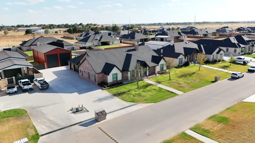 Custom homes and a red metal shop building in Saddleback Estates built by Crystal Cabinets Inc.