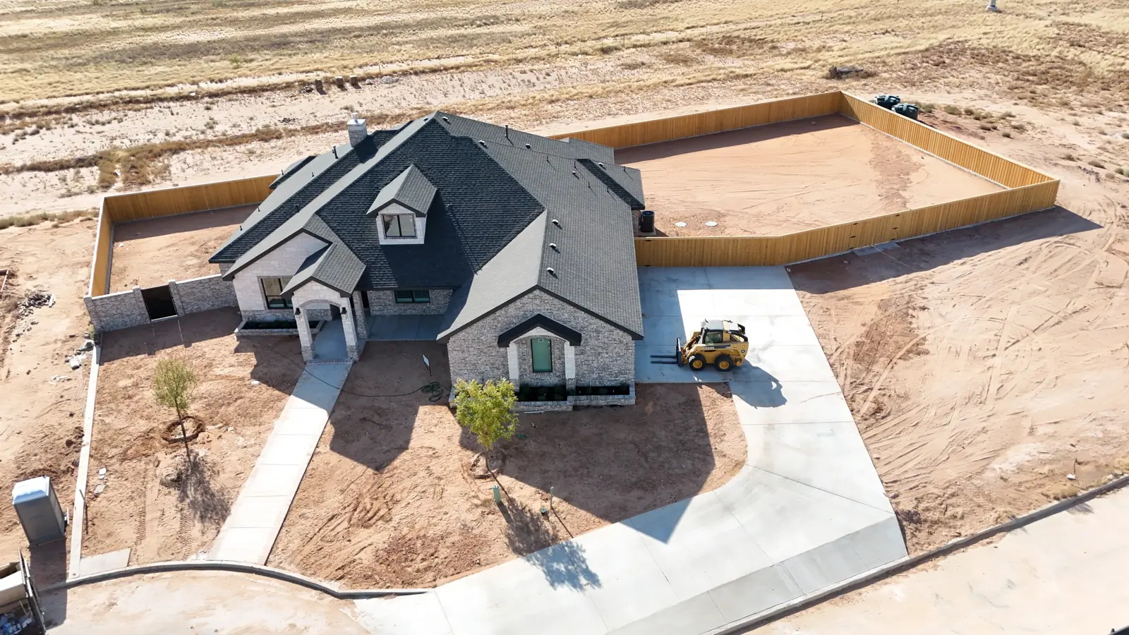 Saddleback Estates: A new custom home taking shape, with fencing and flatwork in place.